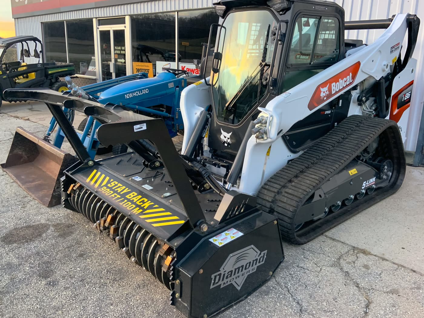 Bobcat T86 compact track loader fitted with a forestry drum mulcher
